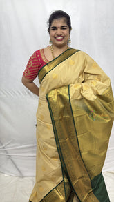 Vriksham Soft Cream With Gold Butta & Veldhaari Green Zari Border Kanchi Silk Saree-VS4770